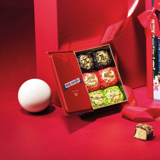 Box of chocolates with a white ball on a red background