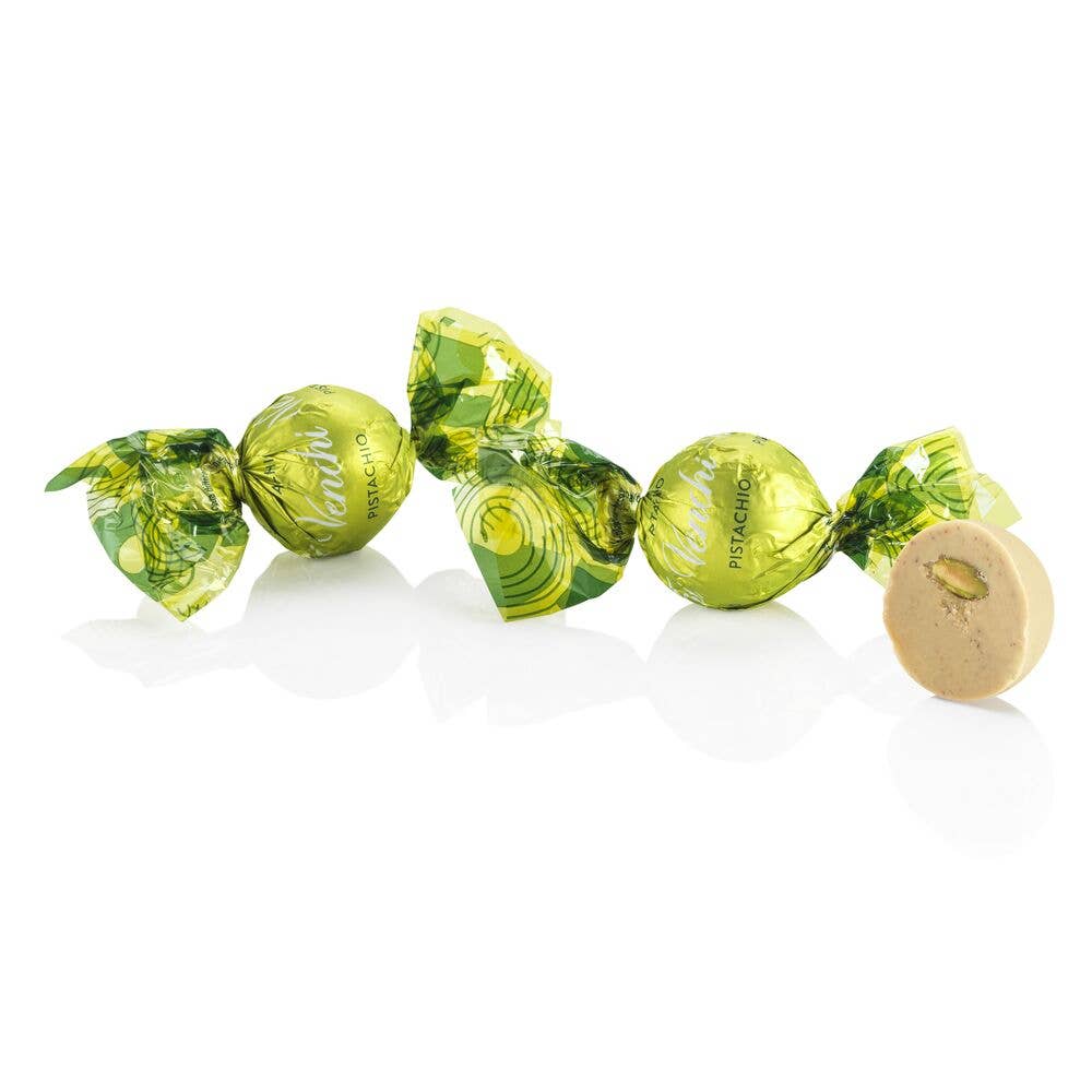 Green wrapped candies on a white background