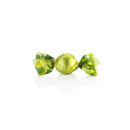 Two green wrapped candies on a white background
