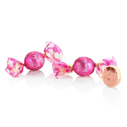 Pink and gold candies with 'Vanilla' text on a white background