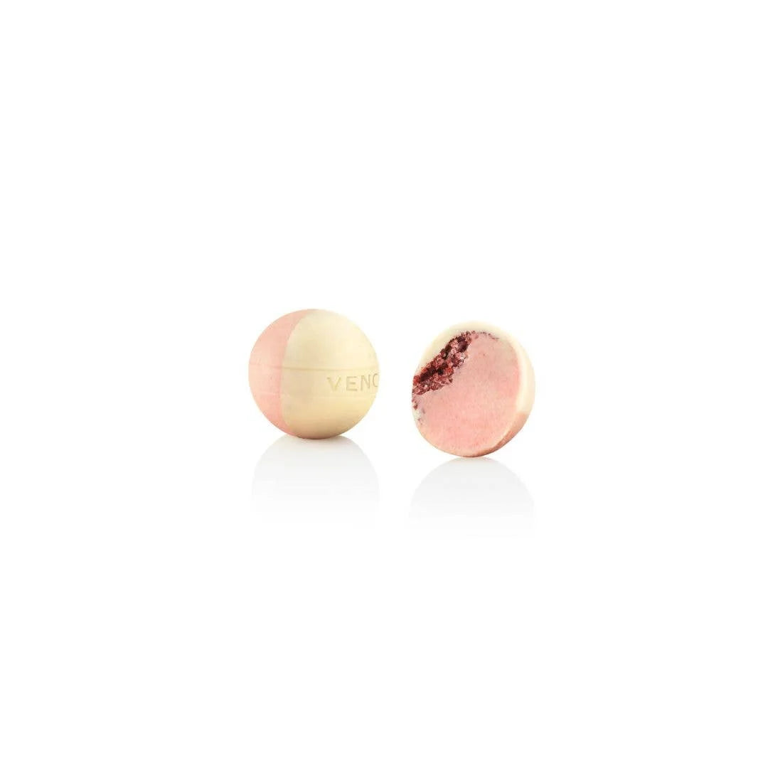 Two colorful bath bombs on a white background