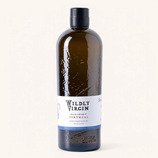 Bottle of Wildly Virgin olive oil on a white background