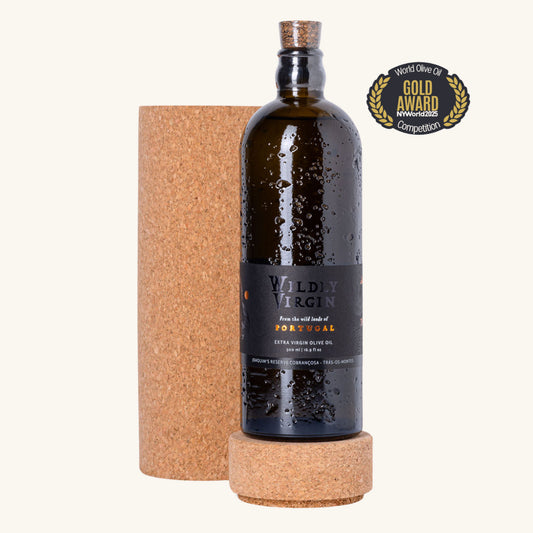 Bottle of Wildly Virgin olive oil with a cork base on a white background