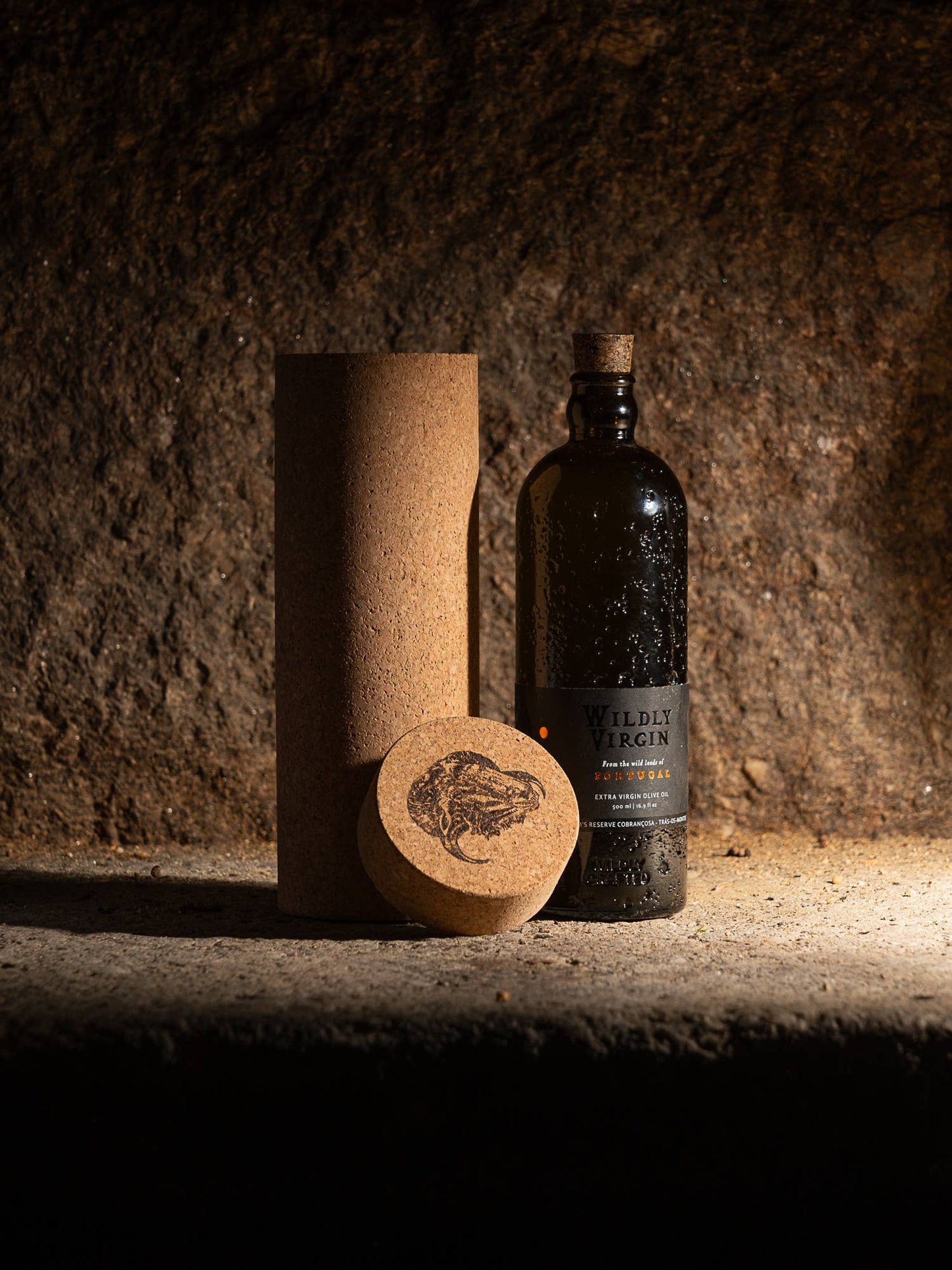 Bottle of Wilder Vodka with cork and cork sleeve on a textured surface