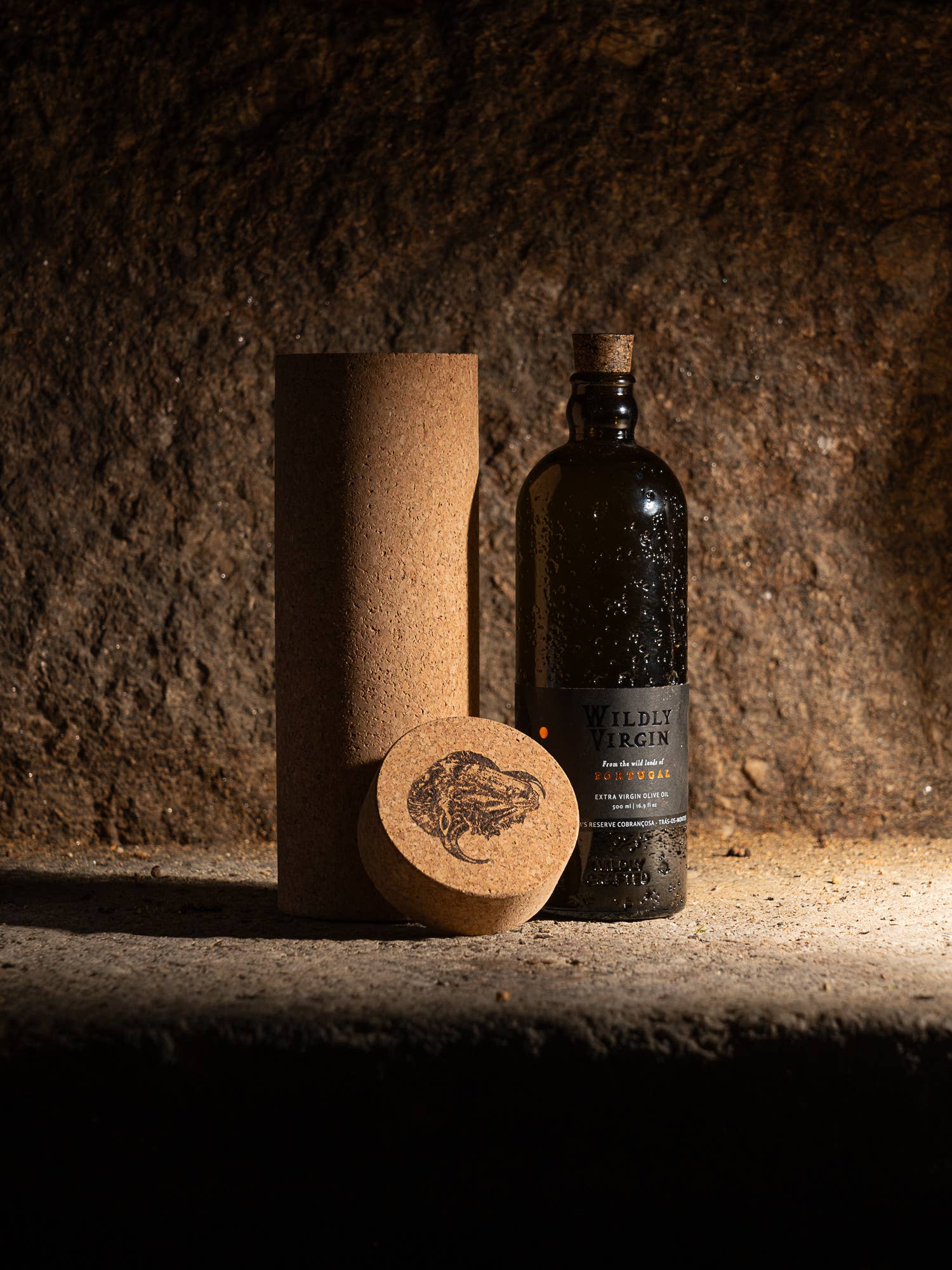 Bottle of Wilder Vodka with cork and cork sleeve on a textured surface
