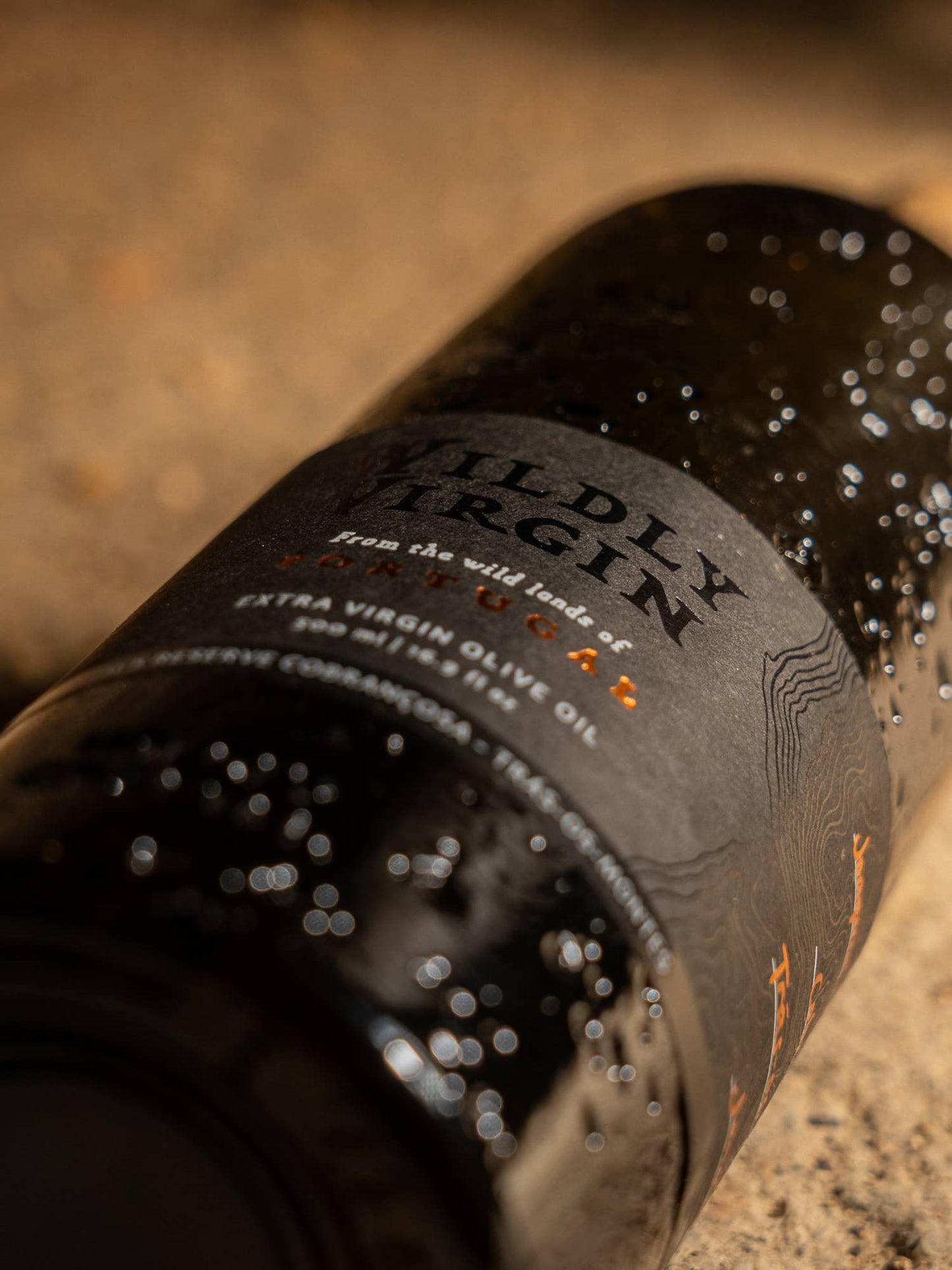 Bottle of Wildly Virgin olive oil with a close-up on the label.