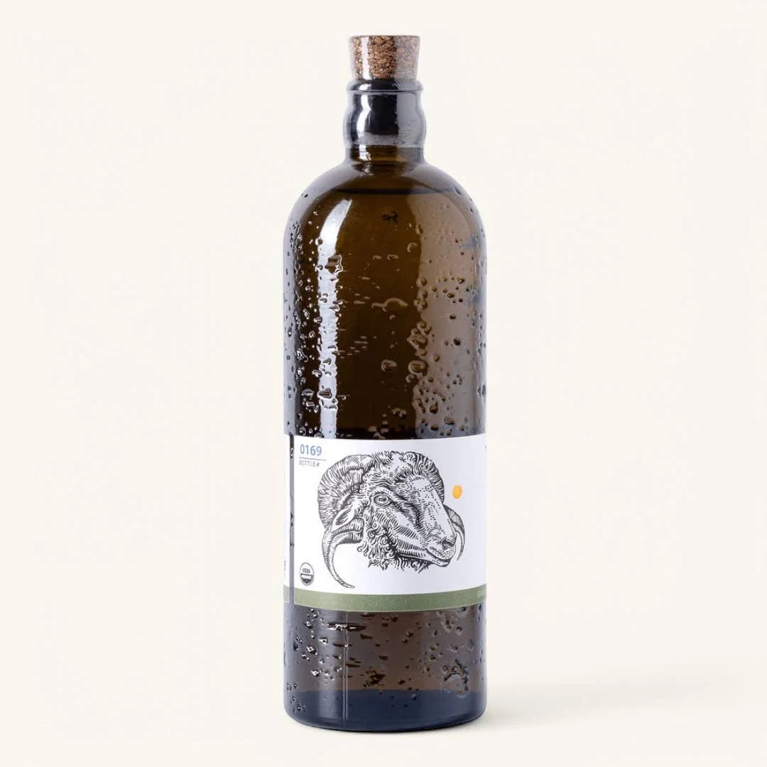 Bottle with a label featuring a horse's head on a white background