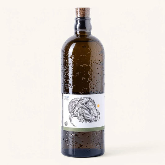 Bottle with a label featuring a horse's head on a white background