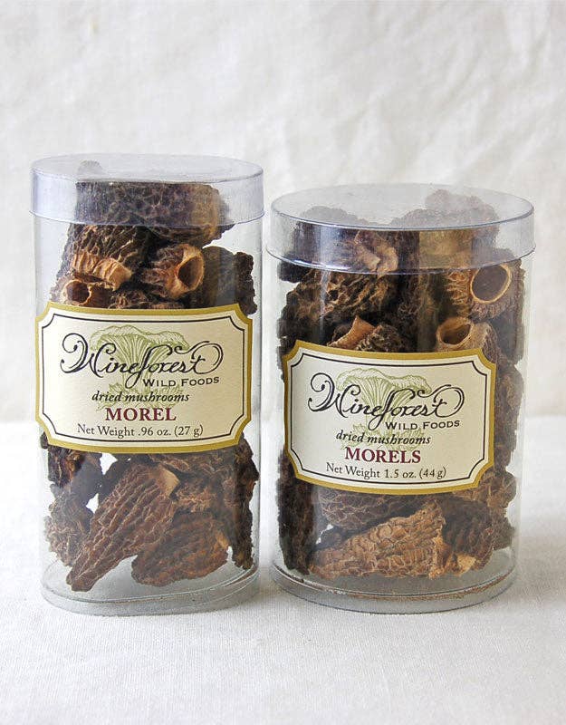 Two jars of morel mushrooms with labels on a white background