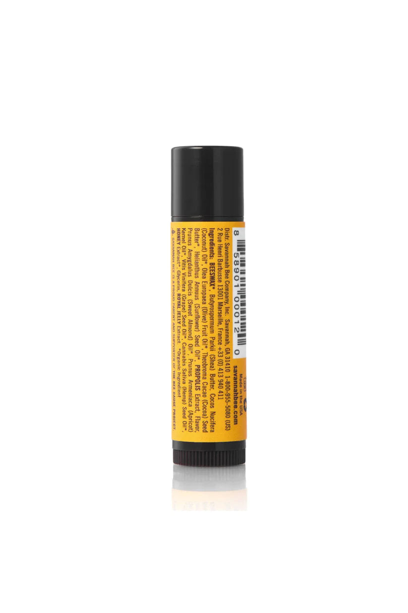 Lip balm tube with yellow label and black cap on a white background